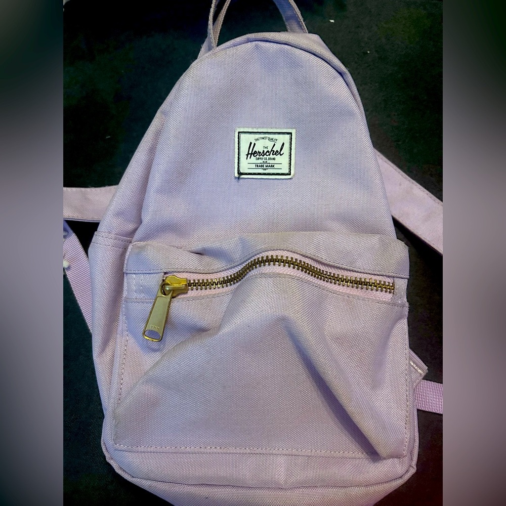 Herschel Supply Nova Mini bacback, lavender with red & white lining.
